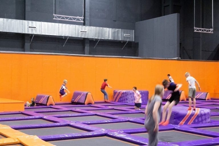 Overview of AirCuebs in trampoline park with children jumping