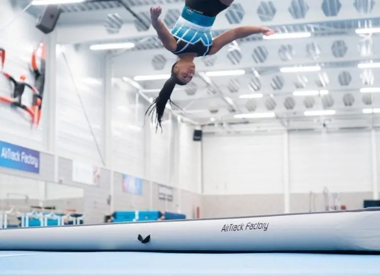 Gymnast jumping high on AirTrack