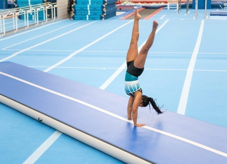 gymnast tumbling on airtrack