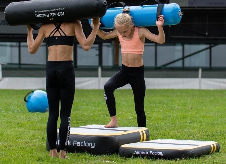 Gymnasts exercising on AirBlock with AquaBags